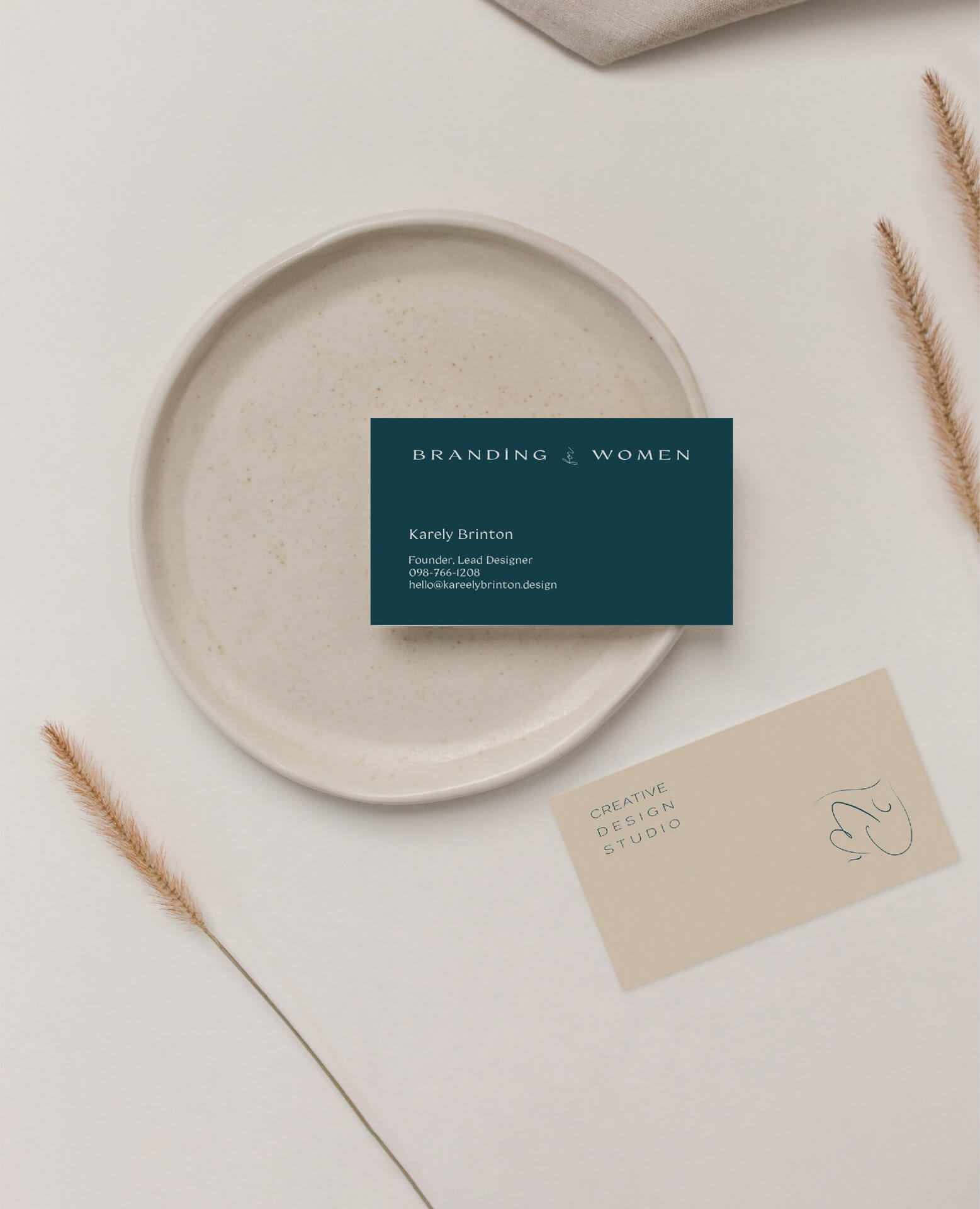 business-cards-sit-on-table-with-dried-flowers-identity-for-branding-for-women